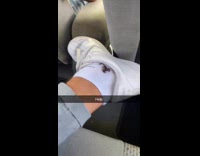 Submitter on car with scorpion on socks