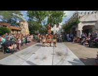 Man carry three people disney world performance