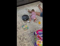 Baby chase robot vacuum face hit cabinet