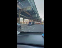 Blue SUV with long glass panels sticking out