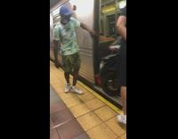 Guys hold subway door open for motorcycle 