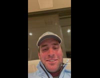 Woman marking up wrapping paper to hang photos