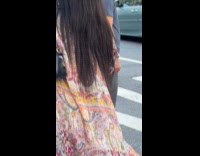 Collab WINY - Woman twerks on sidewalk at broadway light