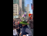 Woman wearing easter themed spinning hat 