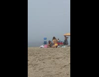 Woman yellow bikini kneel down beach pictorial