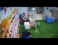 Young boy steal biscuit from a store