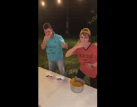 Guy and girl rapping and dancing cooking