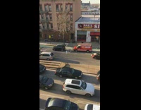 Protesters in yellow jackets and cars with Mexico flag march down the street