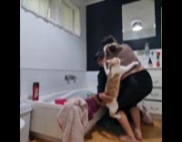 Cat scratch woman back hates bath time