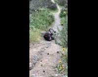 Biker falls off trail on steep section 