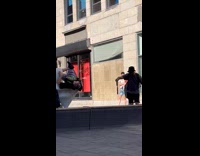 Man pose lies upside down on the statue