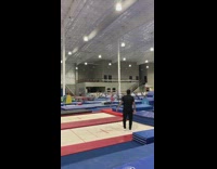 Guy attempts spinning flip on trampoline fail 