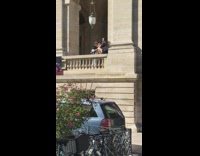 Girl black shirt sit ledge caught lamp