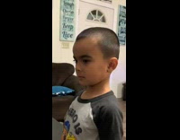 Little boy with half shaved off eyebrow 