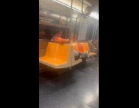 Collab Subway Creatures - Man wears clown costume on train ride