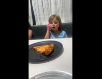 Young girl acts like having phone call drama