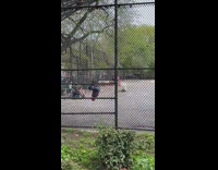 Spiderman hanging upside down on rope at park