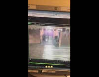 Security camera girl stumbles forward grabs pole