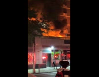 Fire on roof over a plant store