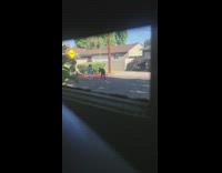 Girl unbuttoned blue shirt dance spin street