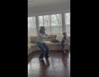 Woman wears a VR Goggles screams and shout inside the house