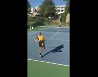 Guy hits tennis ball between legs friend 
