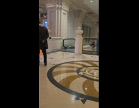 Woman skirt hold drink climb up escalator