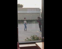 girl white shirt glasses parking lot