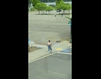 Girl hold striped jacket at parking lot