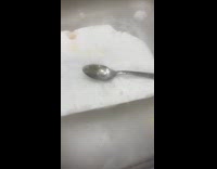Man puts heated spoon on dry ice and vibrates 