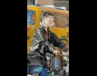 Guy cover plastic on his eyes ride on bicycle at NY