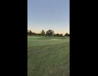 Man golfer lie down grass hill photo shoot