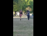 Guy follows records striped dress girl park