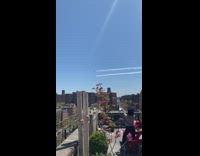 woman red bench roof records planes over nyc