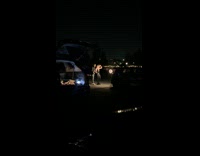 Couple black outfit camera ring light drive in