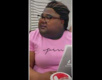 Woman in pink shirt yelling at girl in kitchen while she is cooking