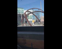 Guy orange jacket dance sphere shaped metal