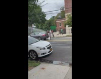 Guy uses open hydrant to wash car 