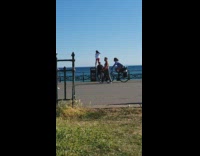 Collab IITW - Girl red pants stand trash bin railings