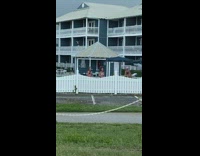 Two girls bikini dance tiktok white fence