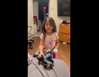 Girl performs magic throws sticky ball away