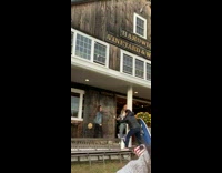 Two girls jacket dance outside vineyard house