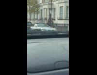 Two women in winter jacket tiktok dance sidewalk