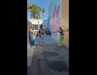 Woman yellow pants skate shoes kick up