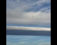 Flat clouds form in sky at desert 