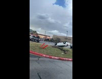 White car gets towed upside down