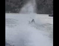 Girl keeps falling off board behind boat