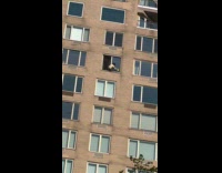 Window washer cleaning windows without safety gears