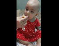 Bald bay red dress drink lemon juice