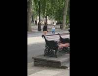 Woman black coat dress spin street middle